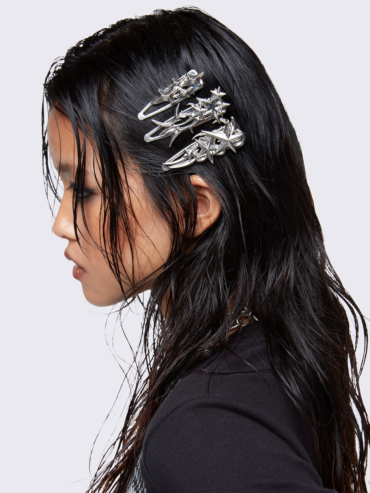 Silver hair clip 3 pieces set with stars design.