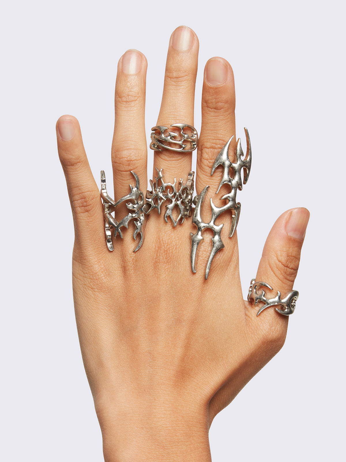 Set of 5 silver rings with sigilism tribal designs.