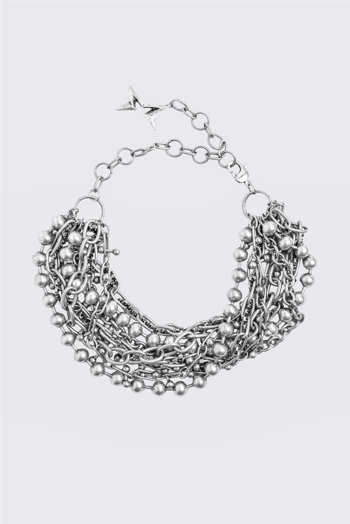 Silver layered chain collar necklace with mixed ball and curb chain strands and chunky multi-strand detail.