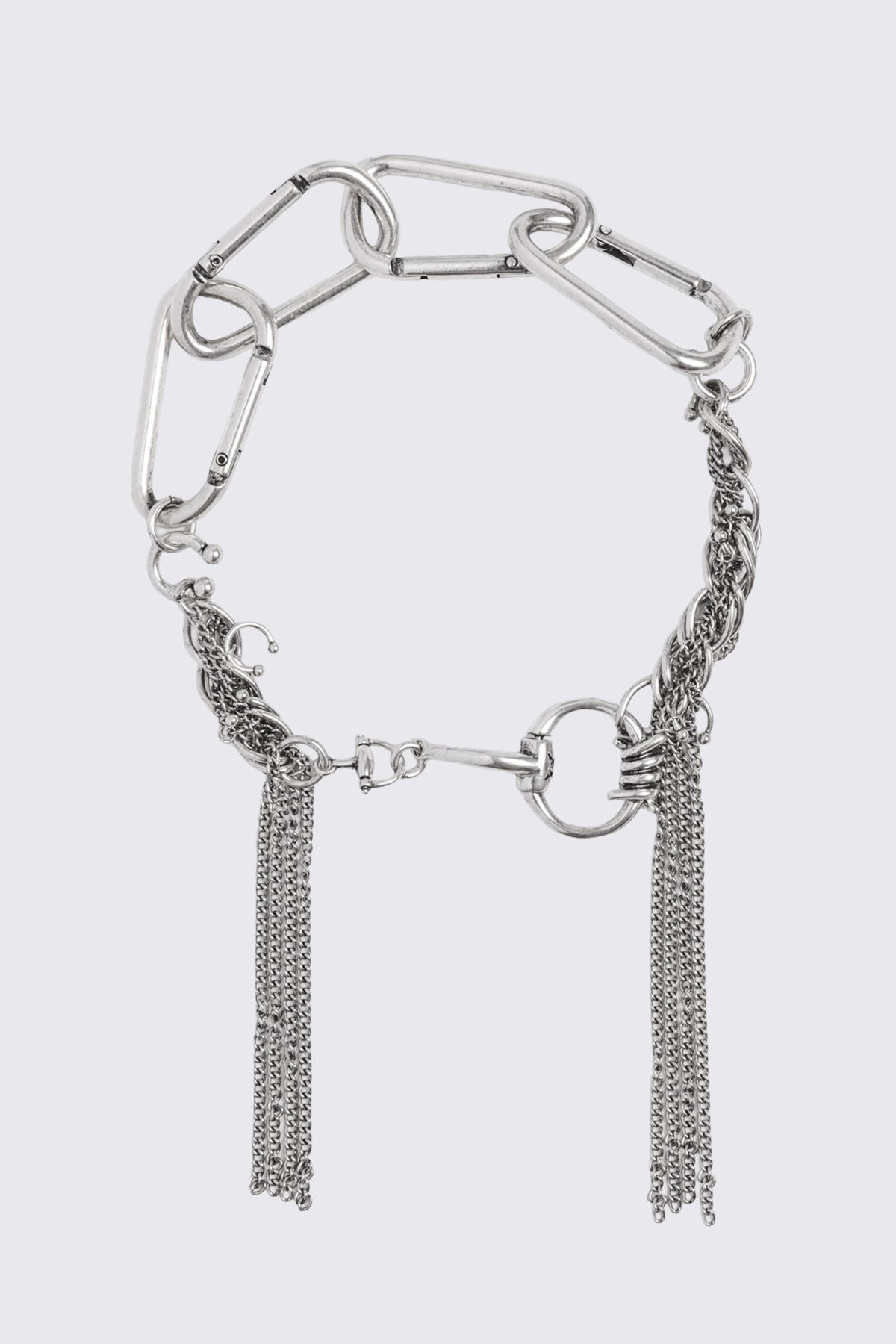 Asymmetrical necklace in antique silver with carabiner links, horsebit detail, and chain tassels in a grunge style.