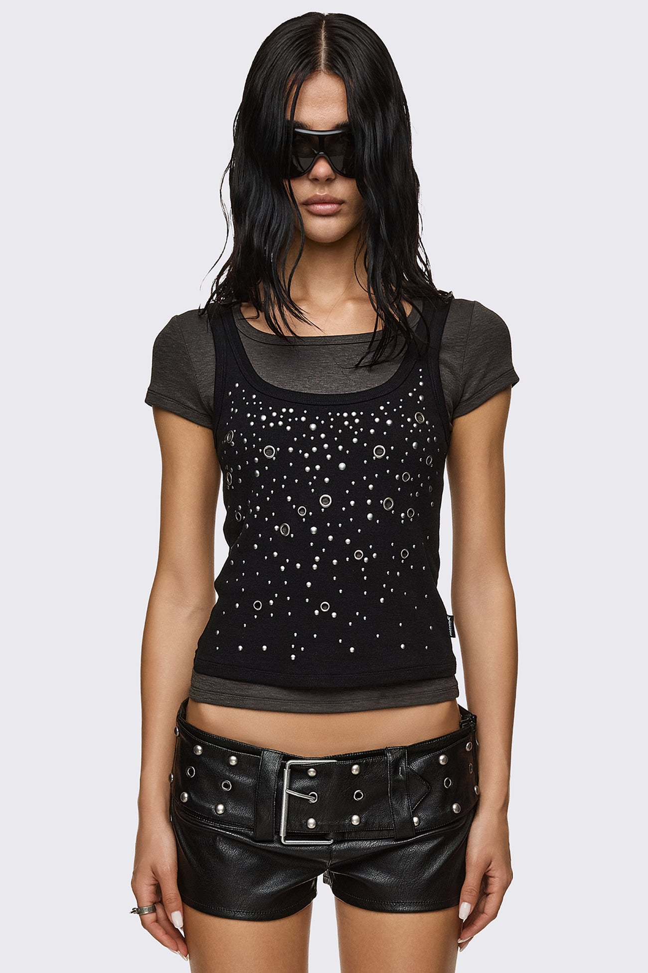 Baby tee in gray and black stretch cotton with layered tank overlay and silver studs, grunge Y2K style.