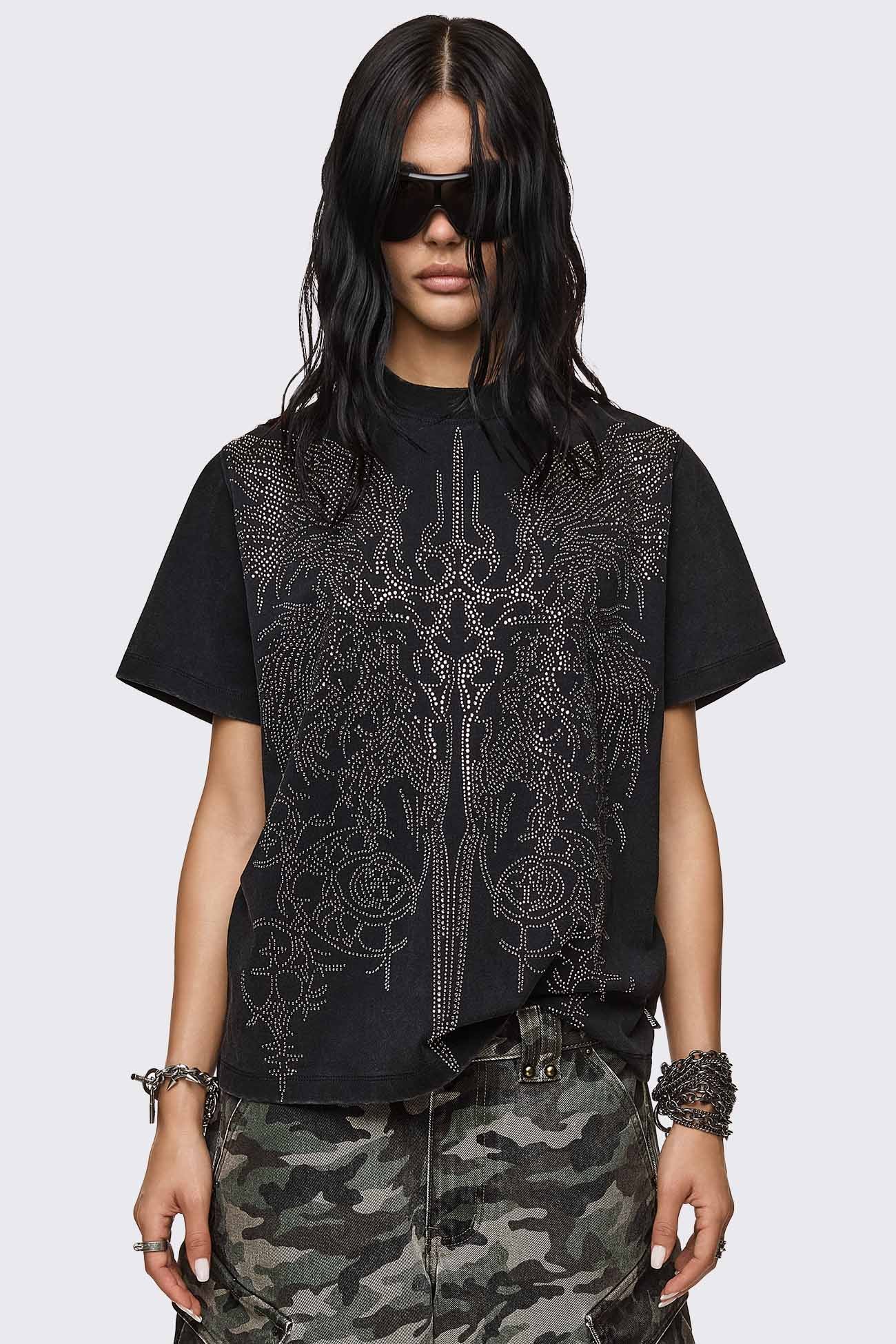 Black cotton T-shirt with rhinestone sigil graphic, relaxed fit, and crew neck in a grunge cyber aesthetic.