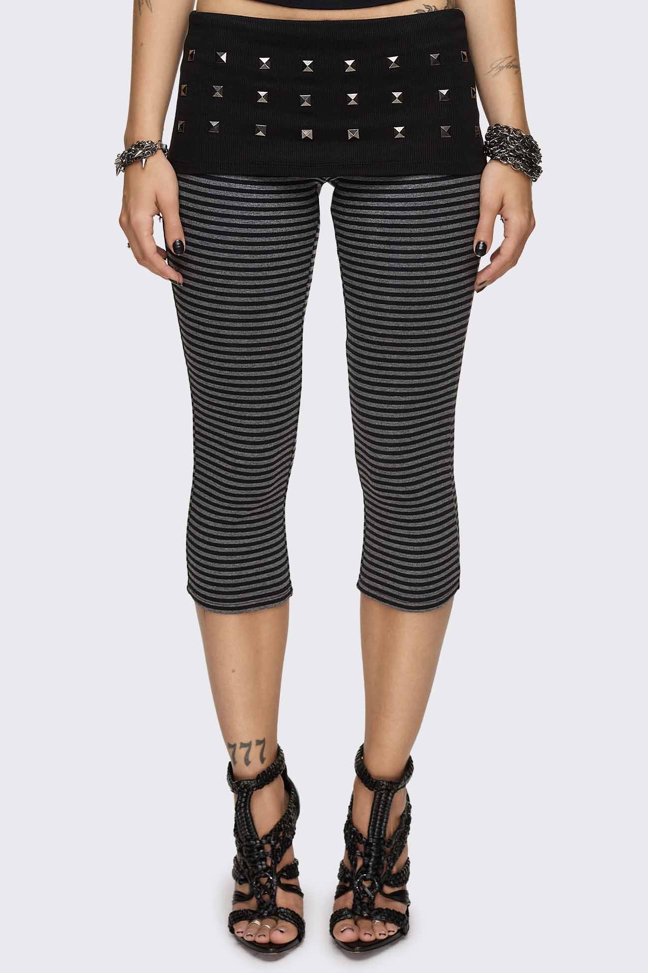 Grey and black striped capri pants with a black studded waistband, high rise and slim fit.