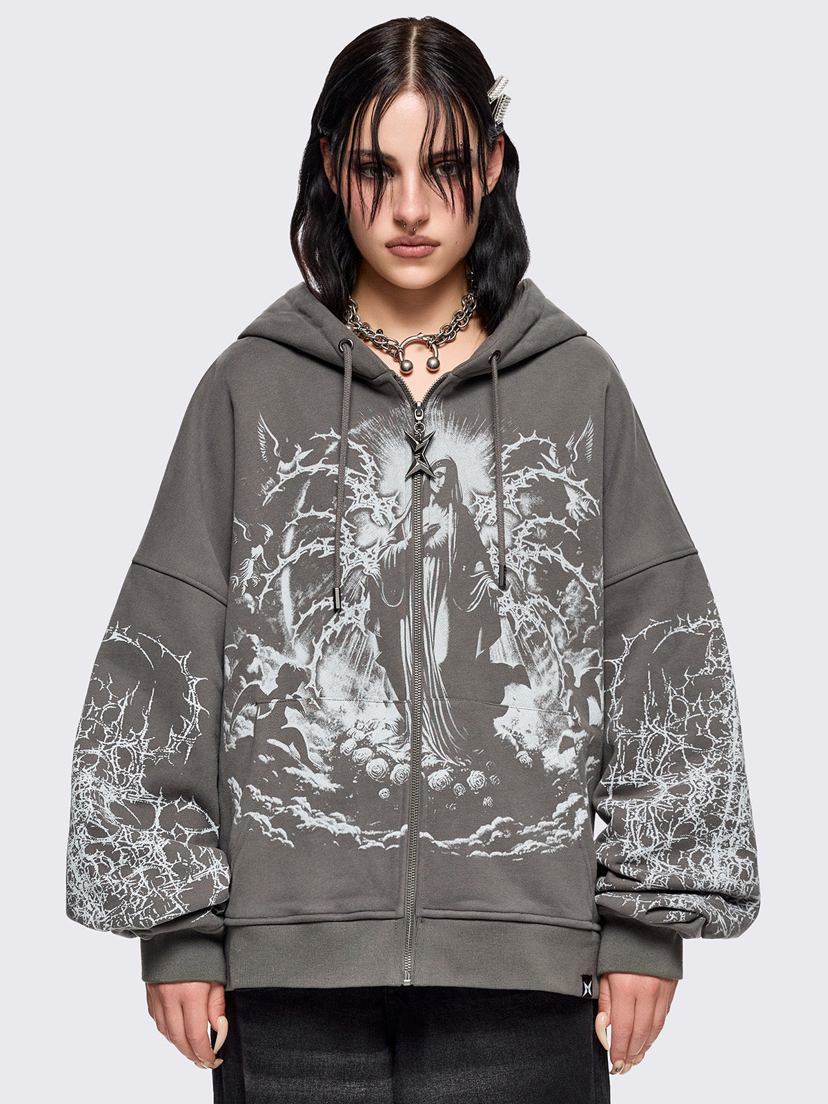 Grey zip up hoodie jacket featuring a sacred figure graphic on front and thorn sleeve prints.