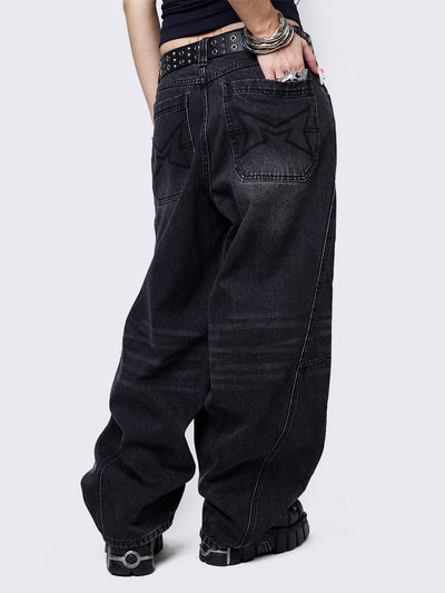 Black washed super baggy jeans with a relaxed fit, regular waist, zip fly, button fastening, and belt loops. Trendy streetwear style.
