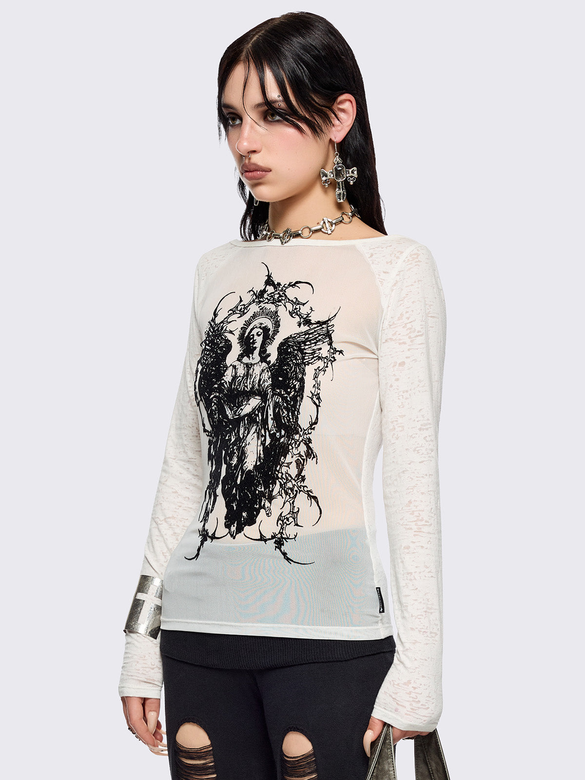 White semi-sheer long sleeve top with a sacred figure graphic front print and mesh contrast.