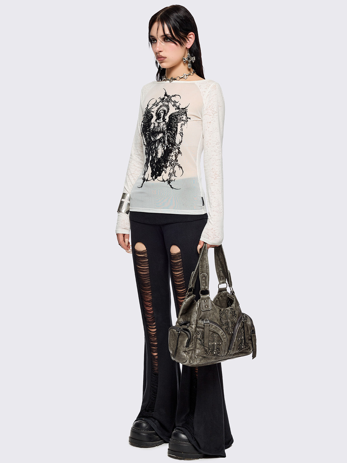 White semi-sheer long sleeve top with a sacred figure graphic front print and mesh contrast.