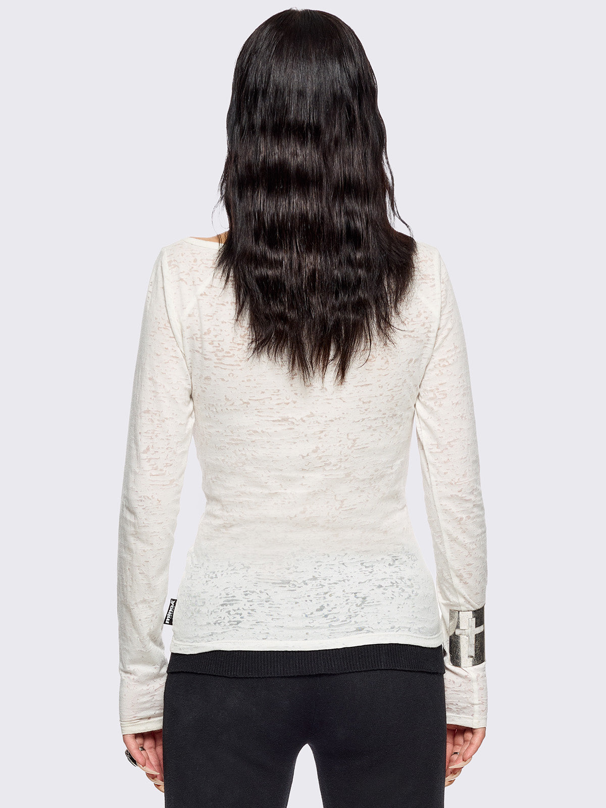White semi-sheer long sleeve top with a sacred figure graphic front print and mesh contrast.