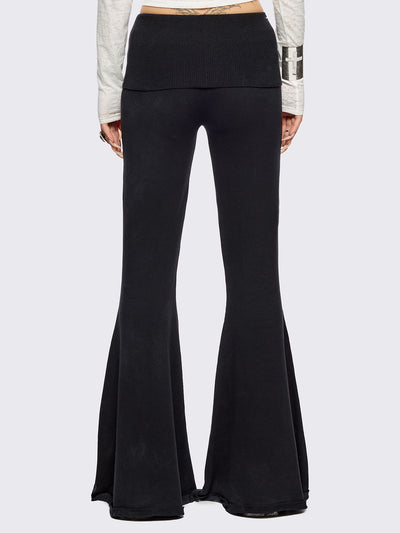 Black distressed flare pants with ribbed waistband. 