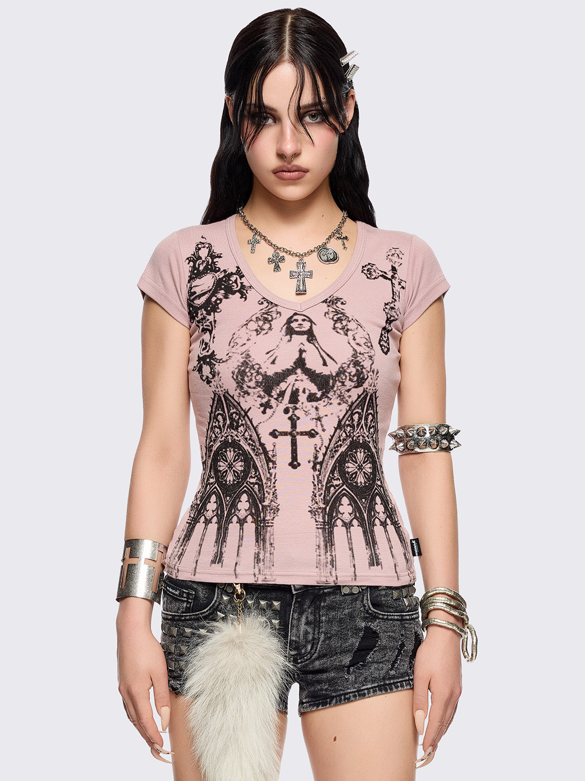 Pink graphic baby te with sacred figure graphic front print.
