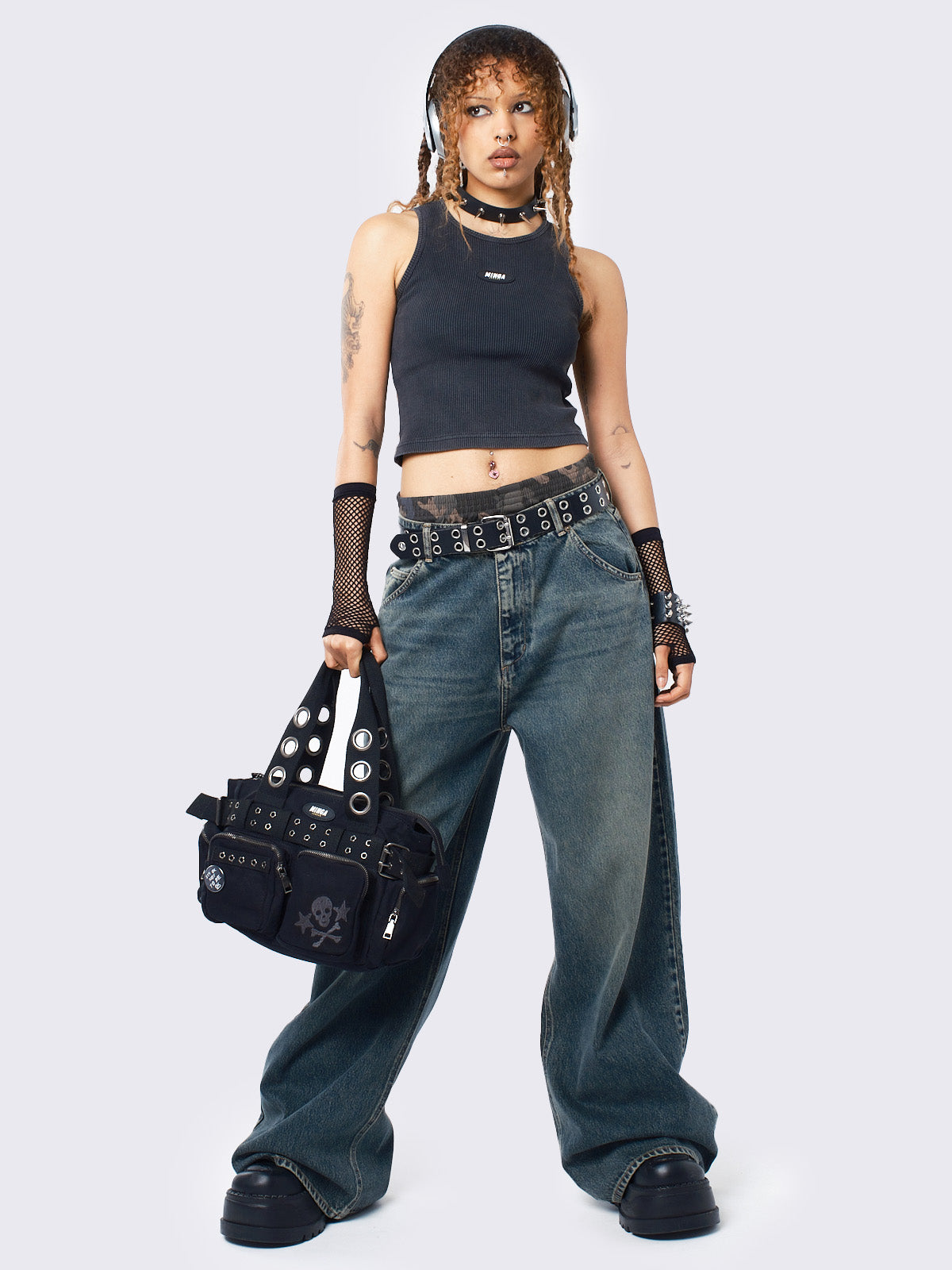 Baggy jeans in washed light blue with green overdye, Minga Star back embroidery, wide leg, regular waist, and relaxed fit. Y2K-inspired and grunge aesthetic.