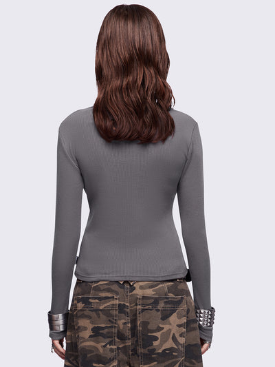 Grey long sleeve top featuring a 
"Feathers stained with chaos" wings graphic print and v-neck style.