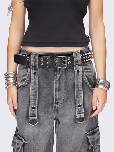 Black vegan leather belt featuring spike studs and square buckle fastening with double keeper.