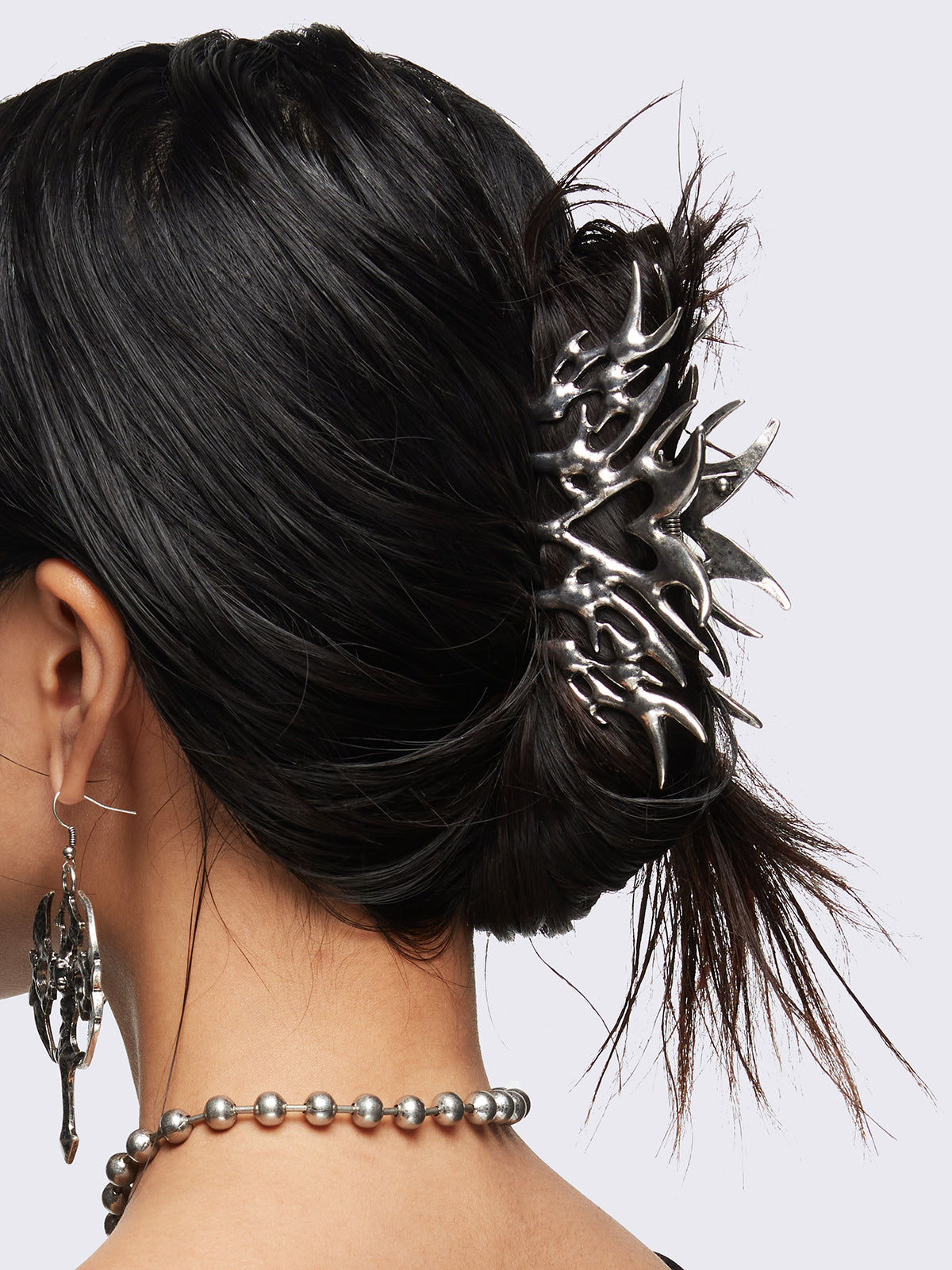 Metal hair claw clip with cyber sigilism heart tattoo design featuring oxidized silver finish.