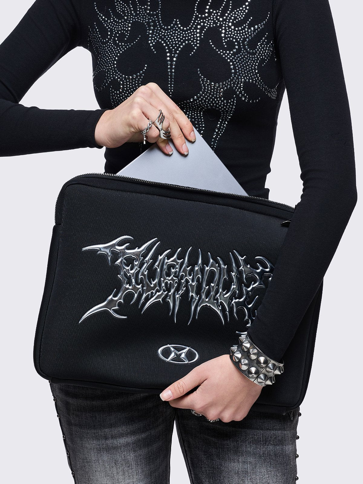 Black laptop sleeve bag with "burnout" sigilism design.