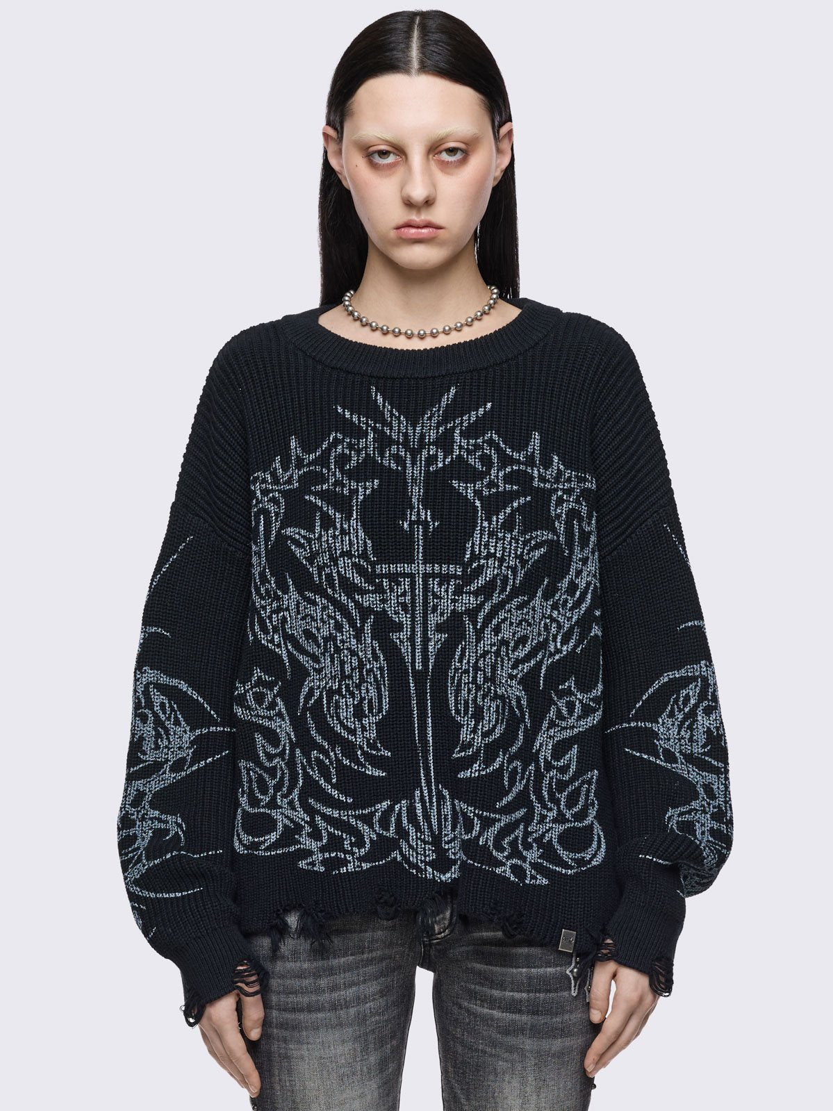 Black knitted jumper with cross sigilism graphic design and distressed rib 