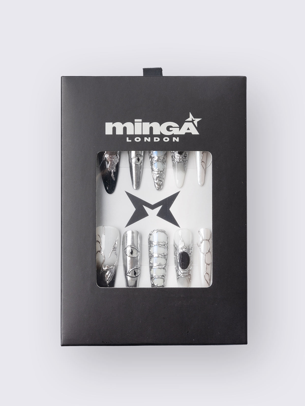 Press-on nail set in chrome and white with marble, piercing rings, chain lacing, and stiletto shape for a grunge glam look.