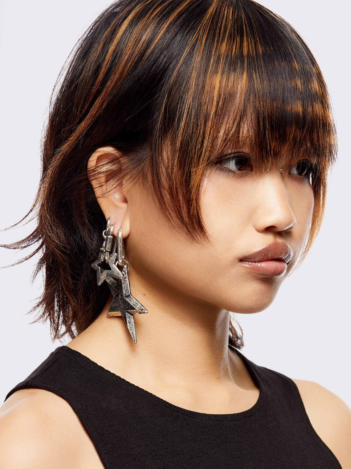 Silver 4pc chunky earring set featuring a mixed textures and bold shapes with star pendants.