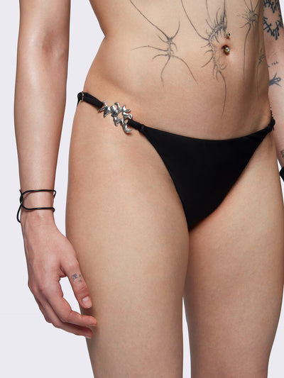 Slim straps bikini bottoms in black with metal details