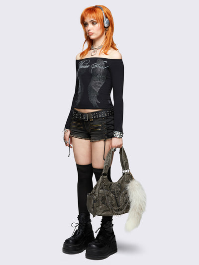 Black long sleeve off-shoulder top featuring hot fix stud wings and "Divine soul" graphic print.