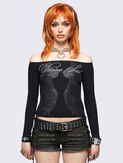 Black long sleeve off-shoulder top featuring hot fix stud wings and "Divine soul" graphic print.