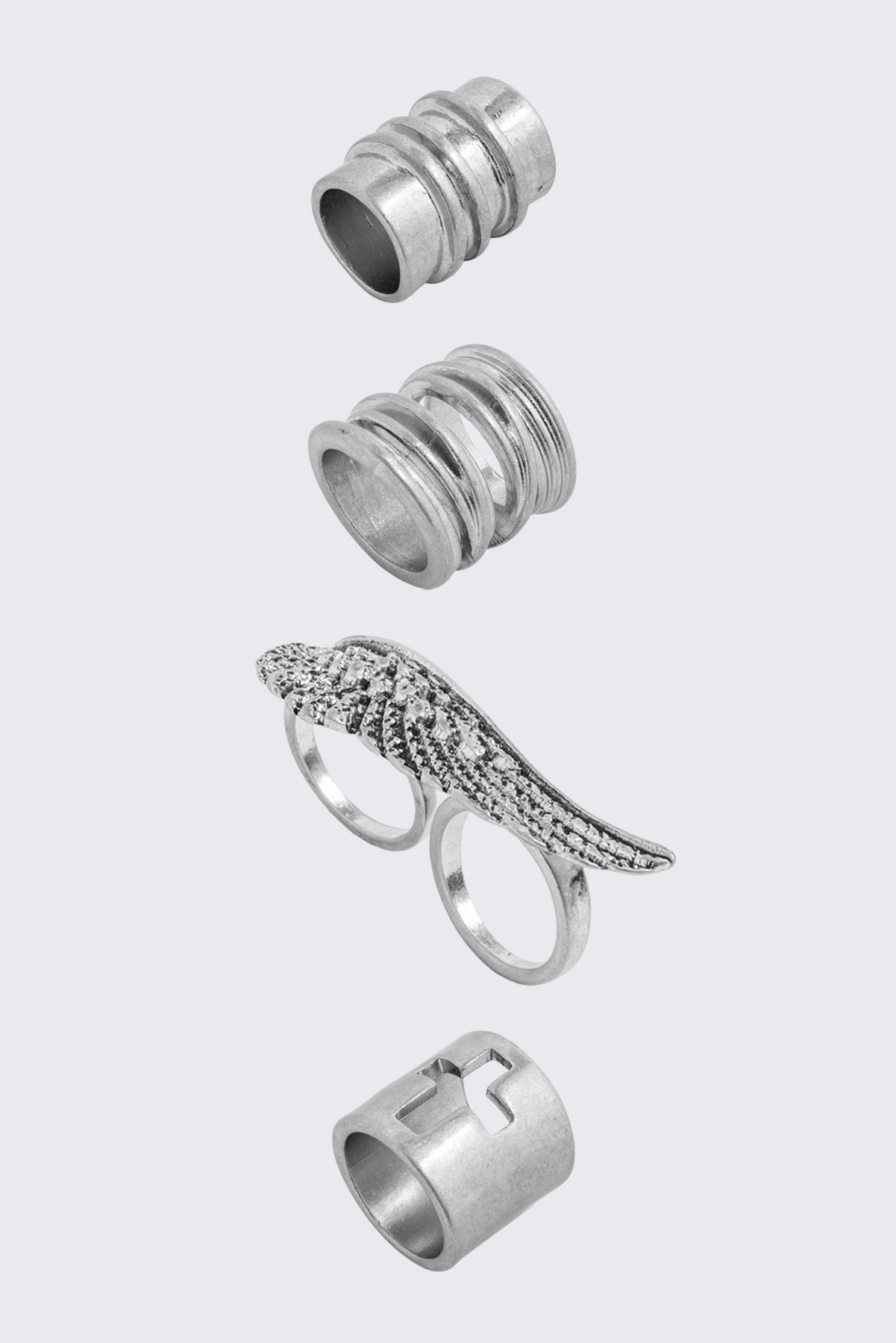 Set of 4 silver rings with wing and cross designs