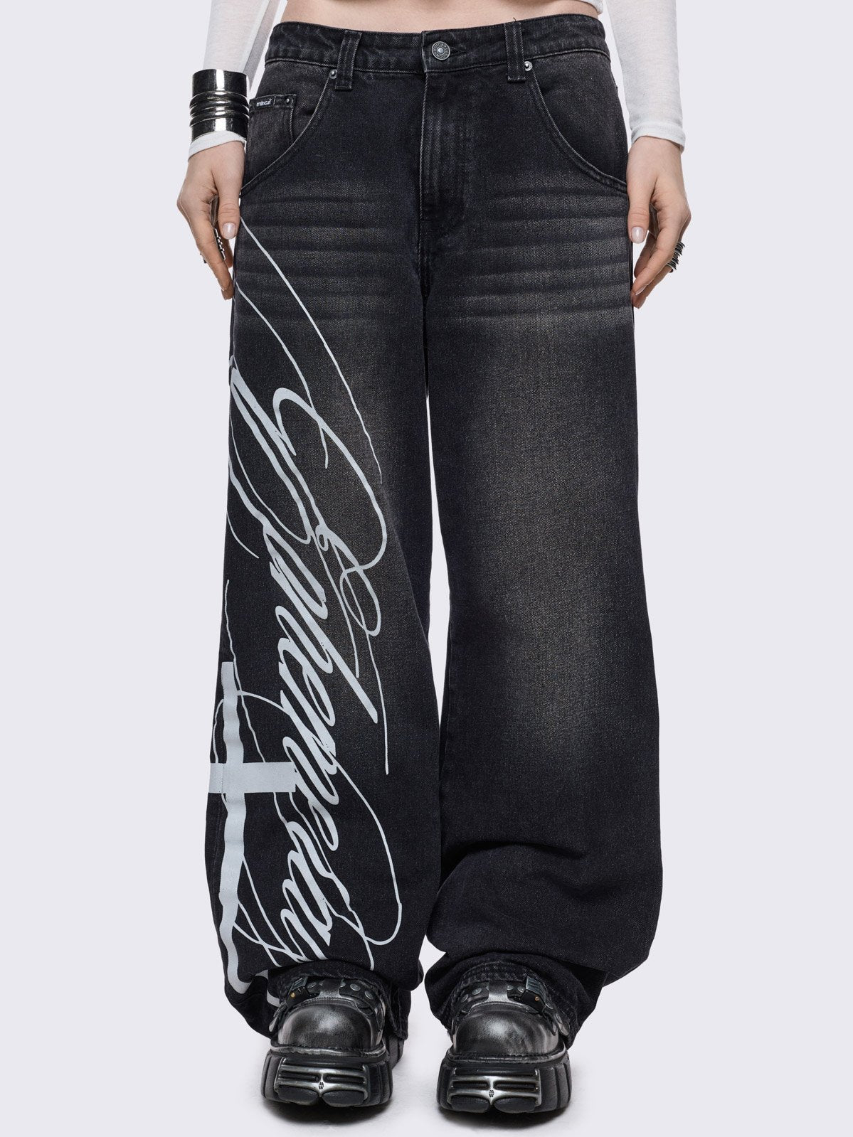 Black washed baggy jeans with white "ephemeral" cross side print