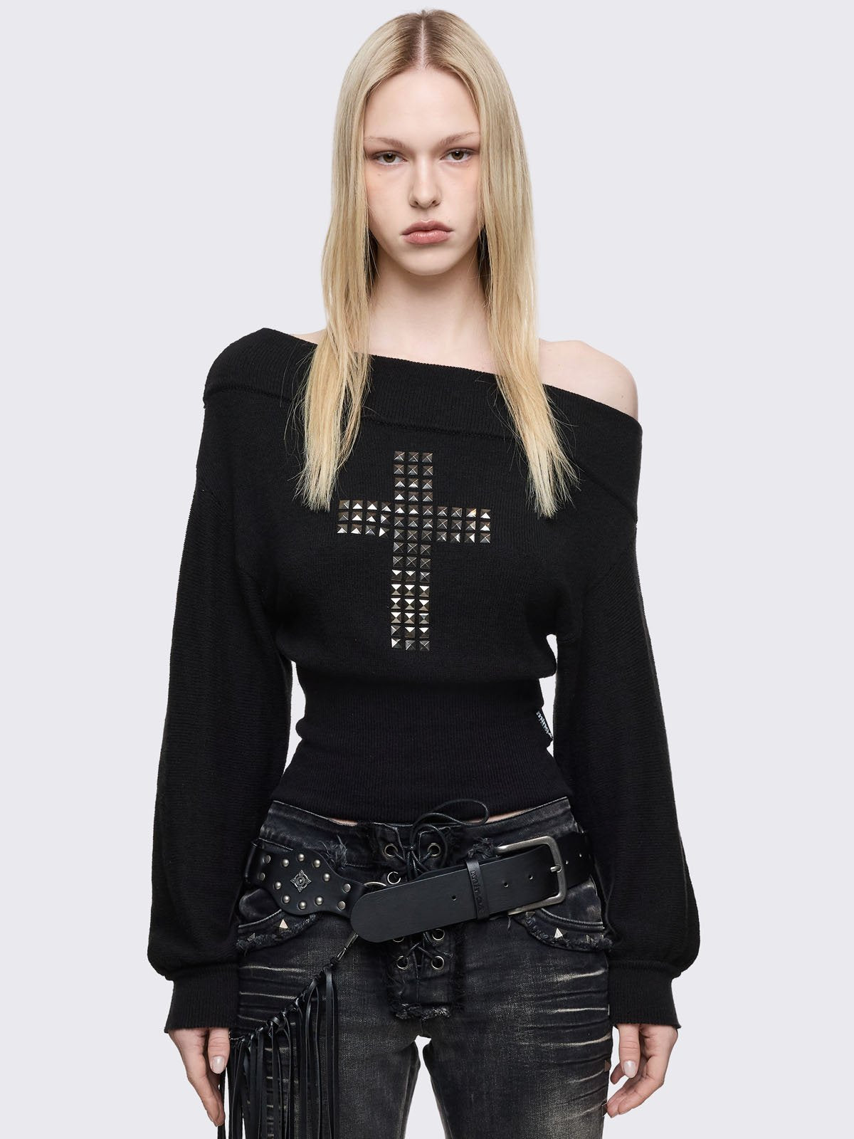 Black off-shoulder knitted sweater with studded cross front design.