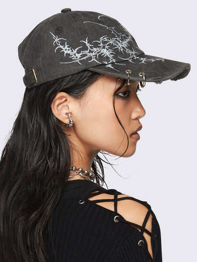 Black washed baseball cap with
Sigilism graphic print and distressed, eyelet and piercing details.