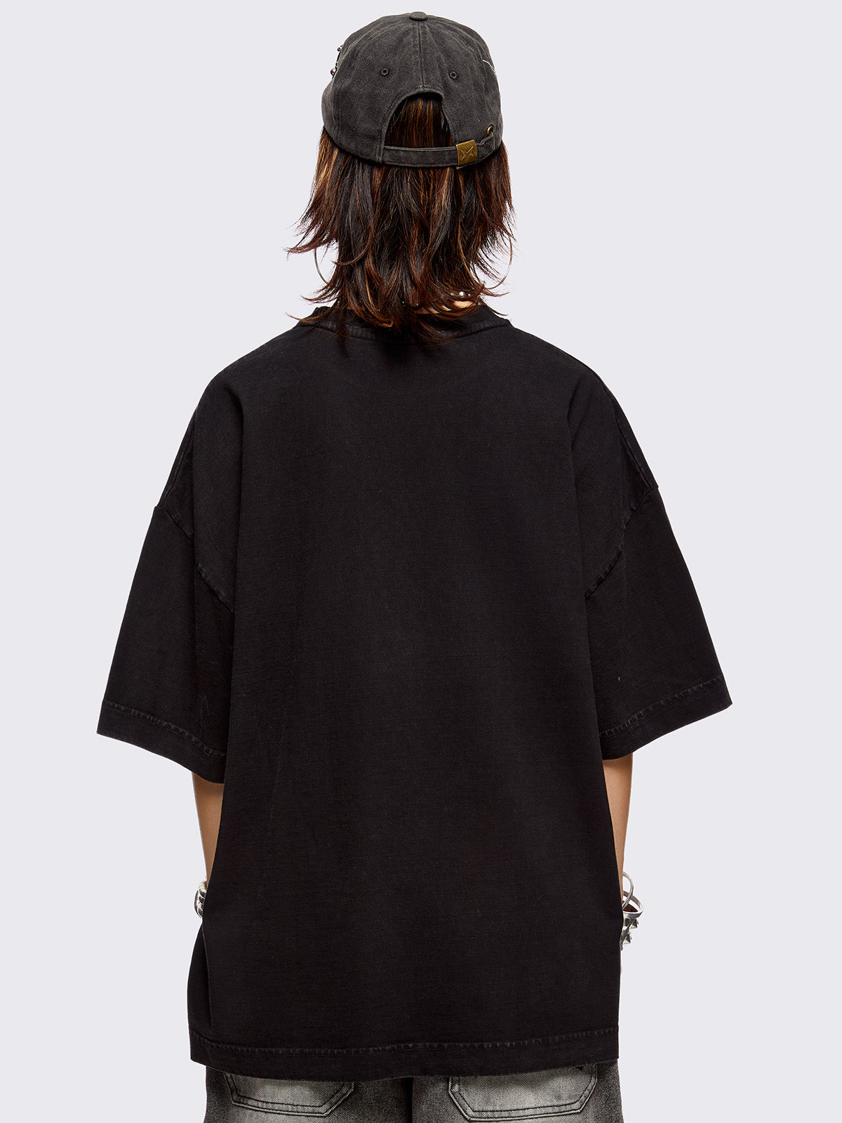 Black washed t-shirt with skulls and sword graphic front print and red embroidery.