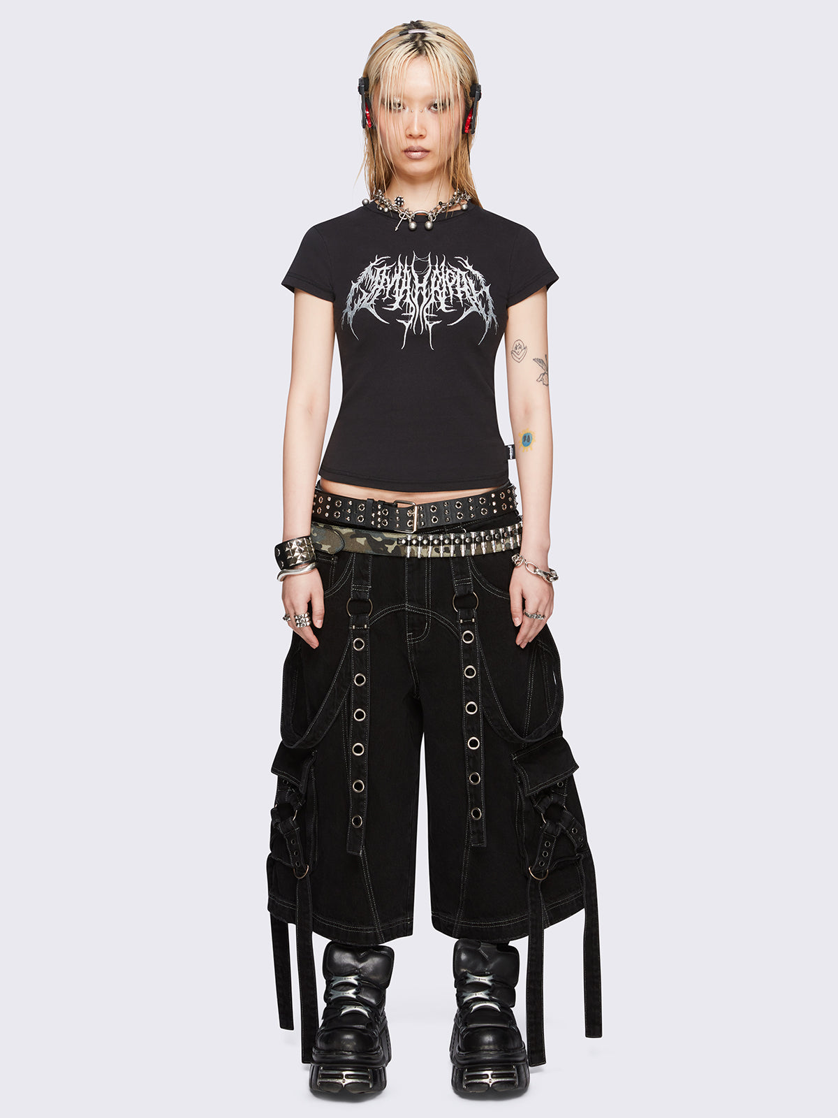 Black slim-fit baby tee with sigil-inspired front embroidery, short sleeves, and regular length.