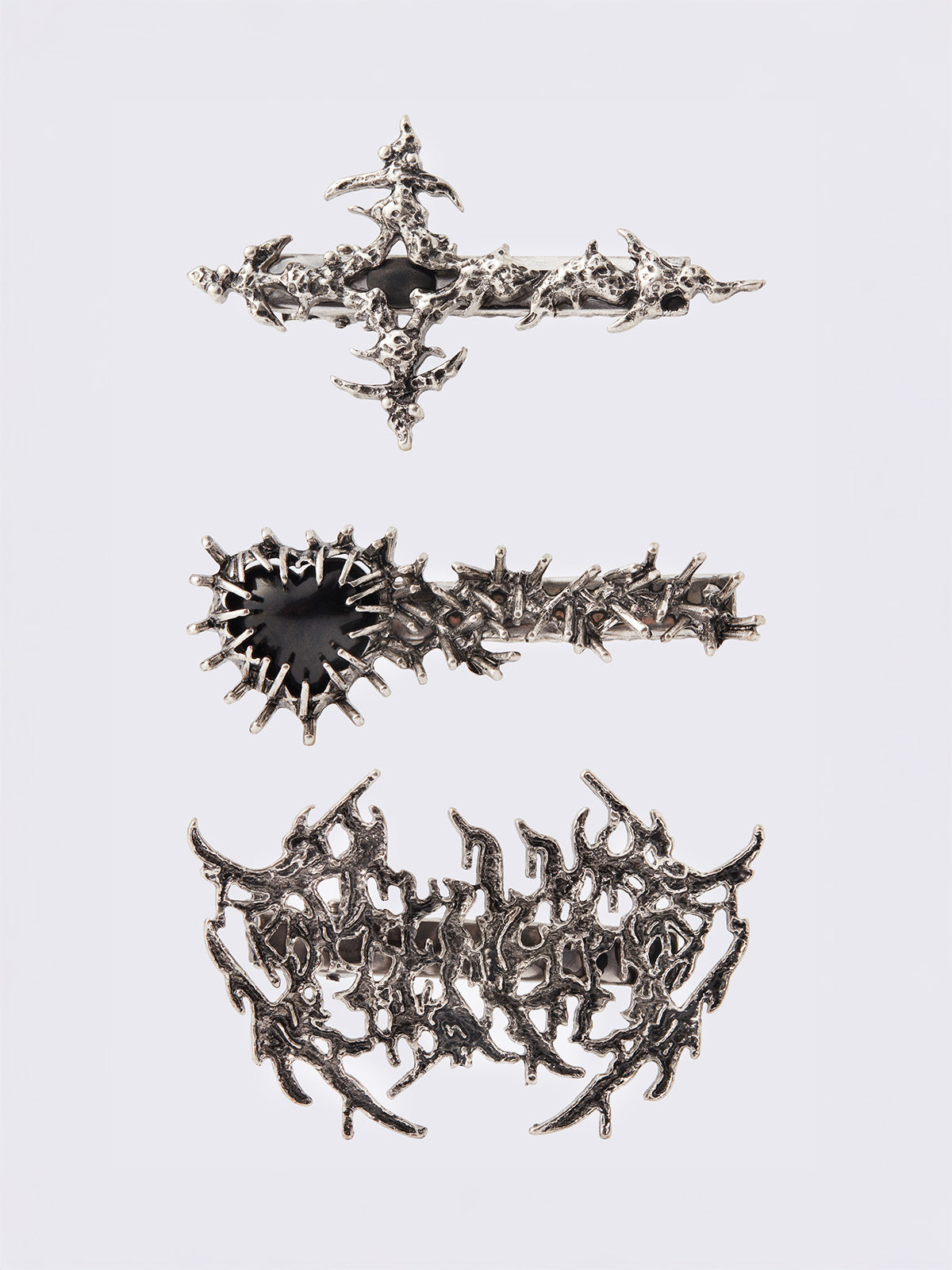 Set of 3 pieces of sigilism hair clips in silver.