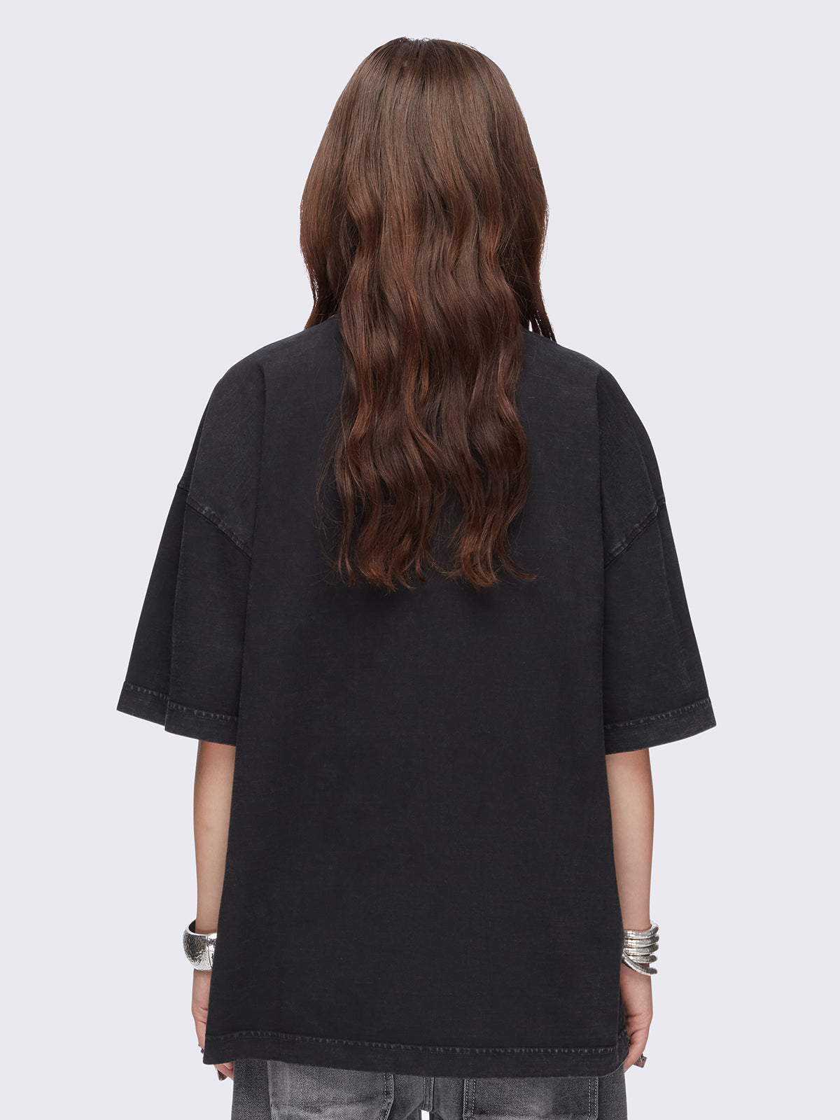 Black washed oversized t-shirt with kitty's mood graphic front print and eyelet and spike neckline details.