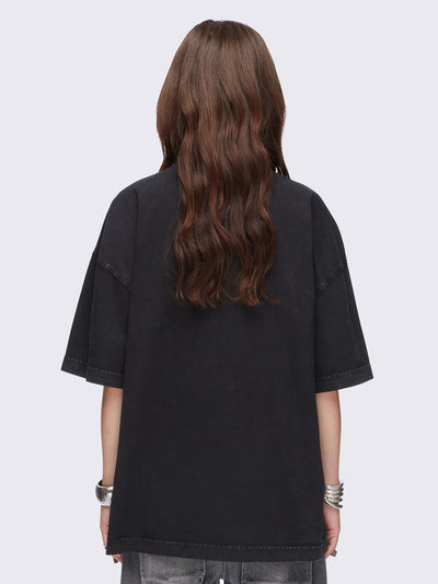 Black washed oversized t-shirt with kitty's mood graphic front print and eyelet and spike neckline details.