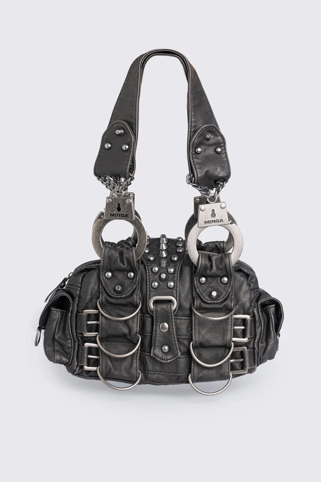 Black vegan leather shoulder bag with handcuffs handles, D-ring, buckle and stud details. Multiple pockets and zip top closure.