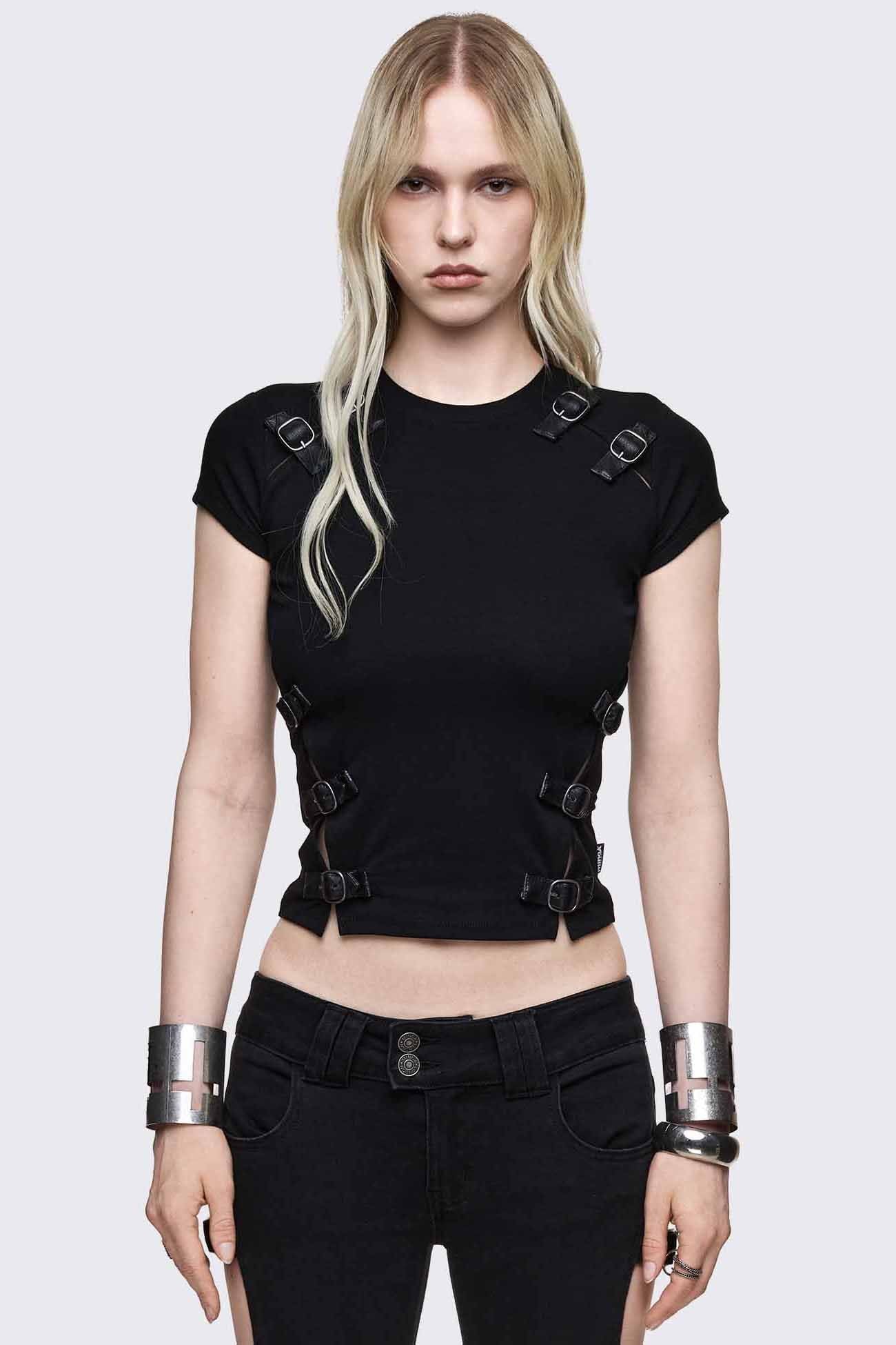 Black baby tee with buckle strap cut-outs, silver-tone buckles, cap sleeves and a slim cropped fit.