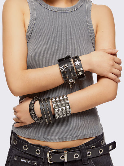 Set of 5 PU bracelets with mix of spikes, stars, zippers and studs. 