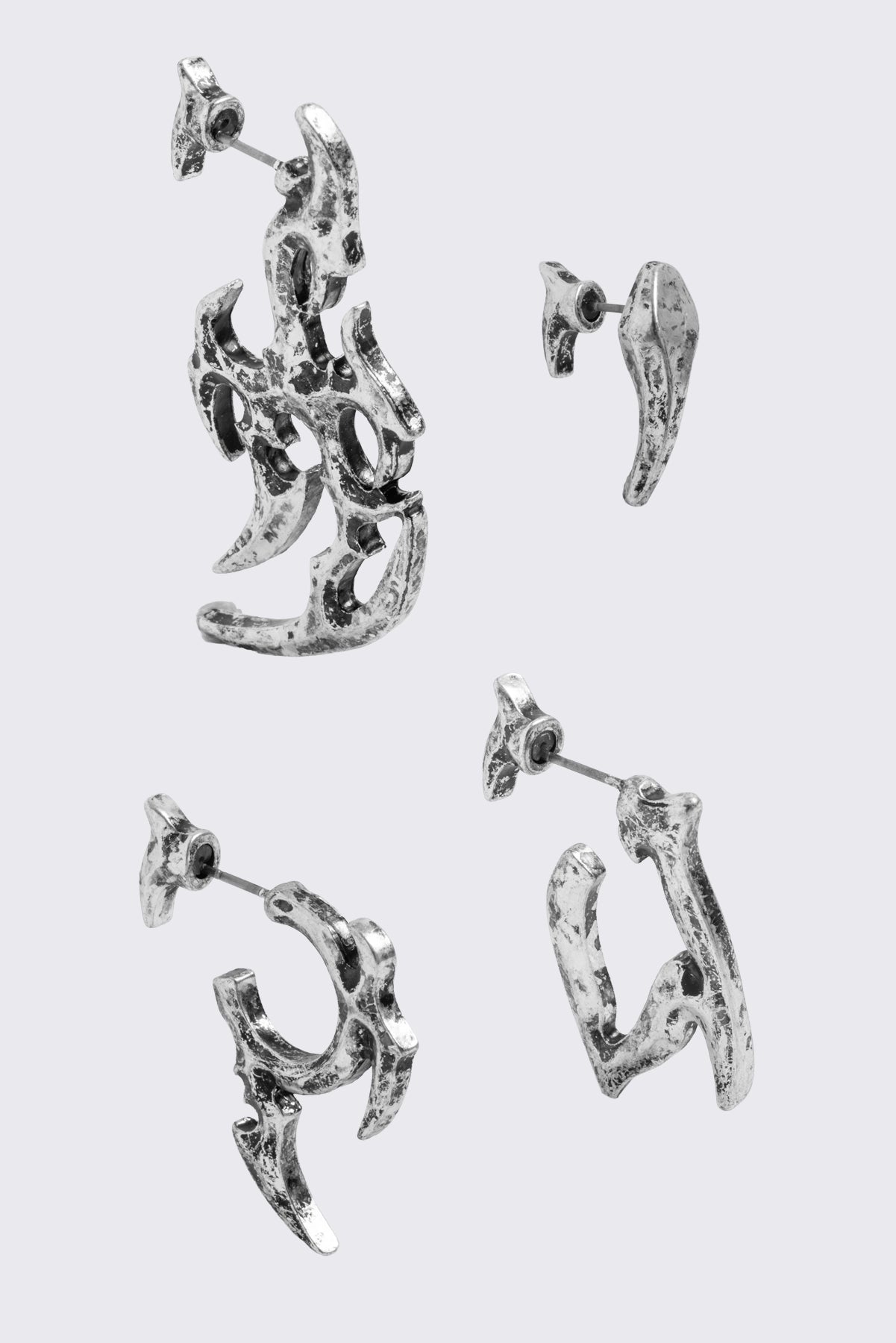 Silver 4pc chunky earring set in sigilism design.