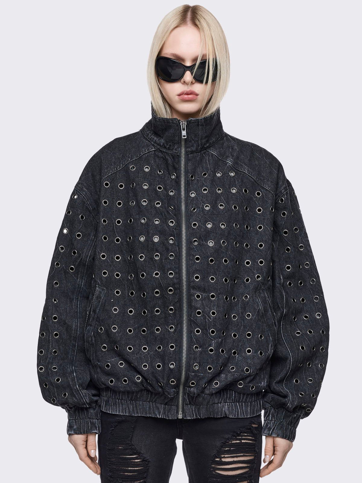 Black washed denim oversize bomber jacket with silver eyelets and seam details. 