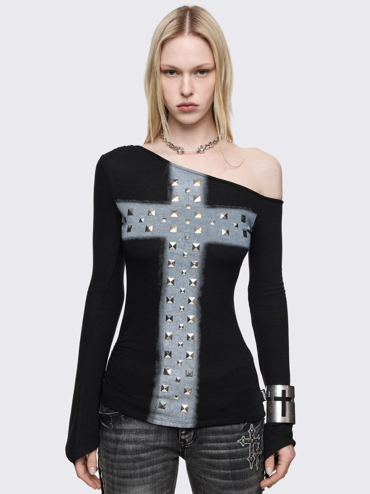 Black long sleeve top with off shoulder style anda c grey chunky cross with silver studs on front. 