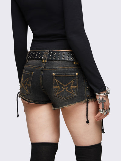 Black washed denim hot pants shorts featuring adjustable lace-up sides and double zip front details.