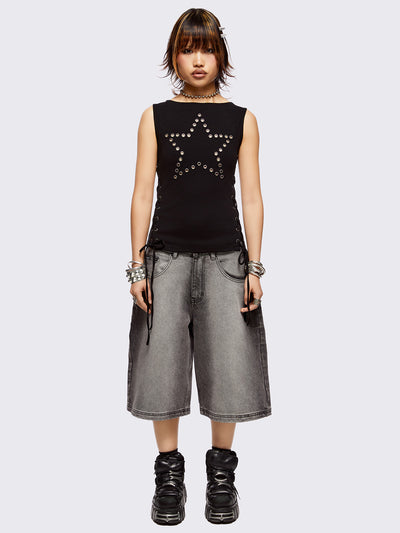 Black tank top with star-shaped eyelet detail and adjustable lace-up sides.