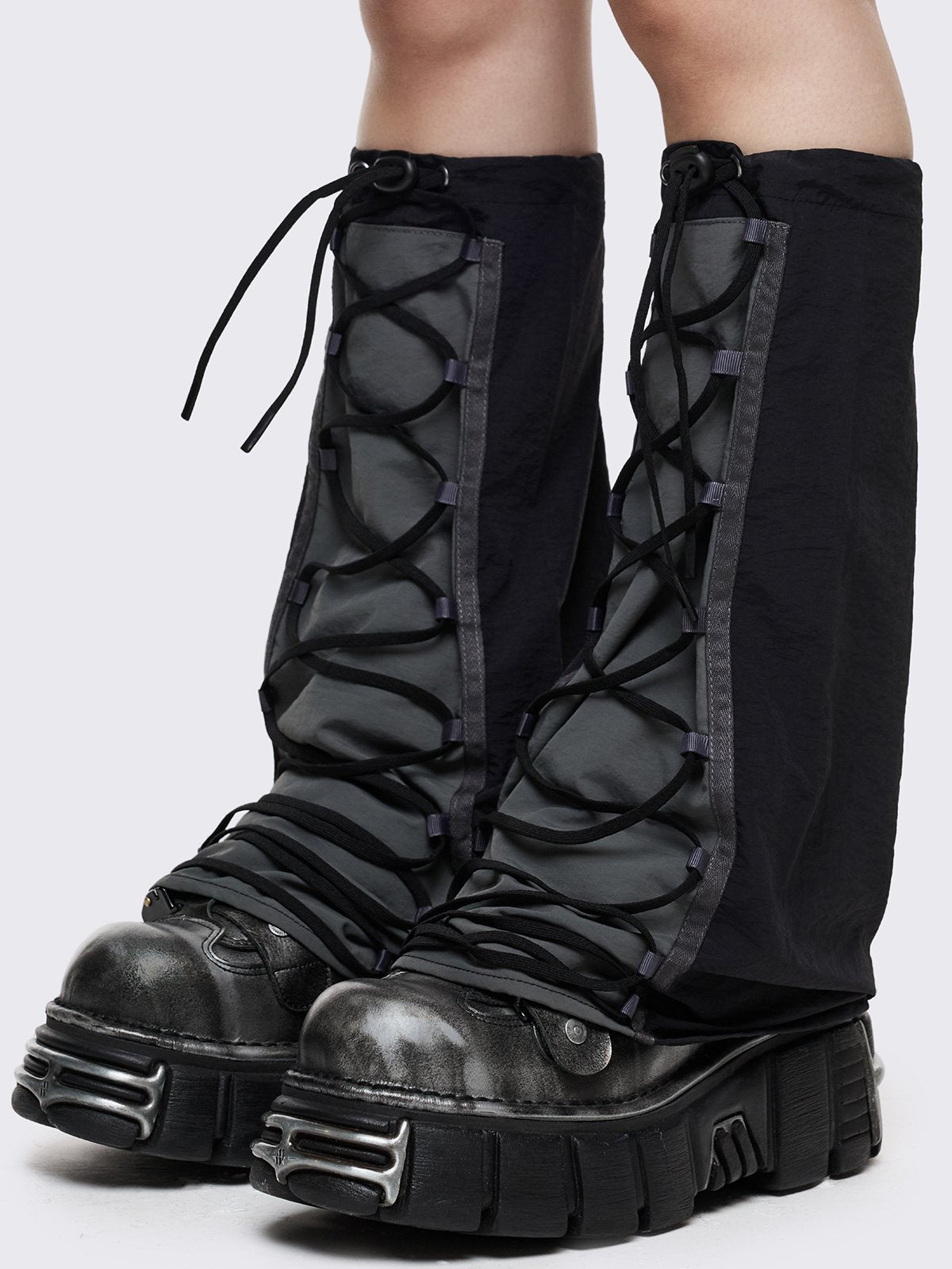 Black tech flared leg warmers with grey panel with lace-up and adjustable toggle
