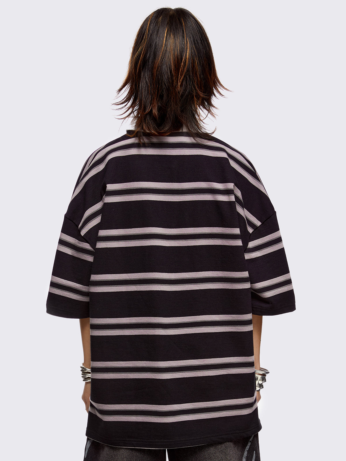 Black and grey striped rugby polo with white spread collar and a oversized fit.
