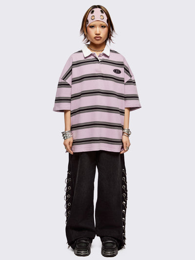 Pink rugby polo with black and grey stripes, white spread collar and a oversized fit.