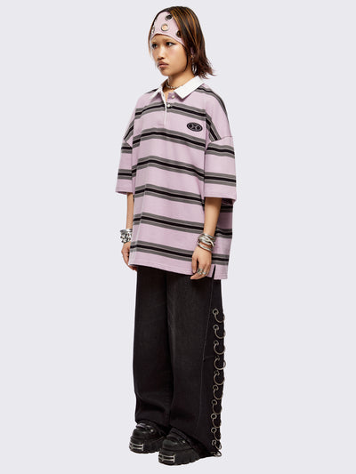 Pink rugby polo with black and grey stripes, white spread collar and a oversized fit.