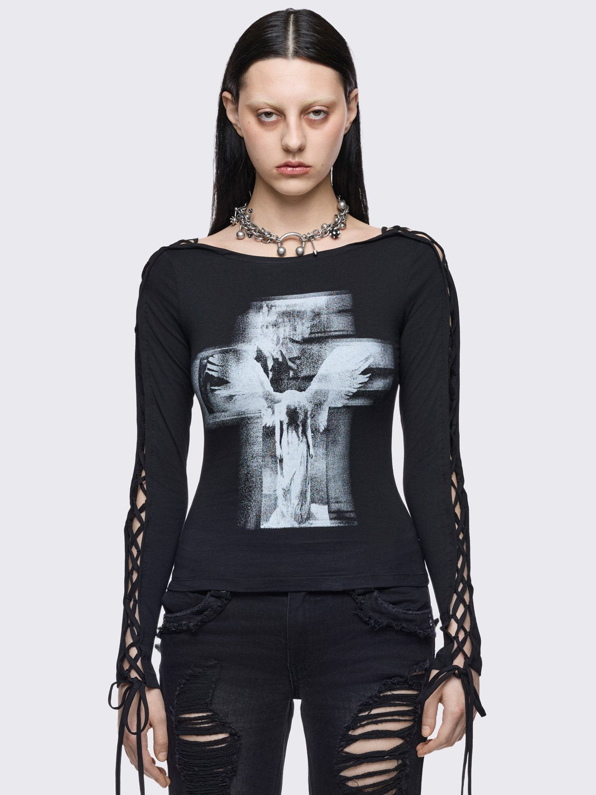 Black long sleeve top with lace-ups and goth cross graphic print