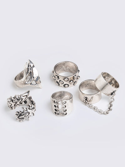 Set of 6 silver rings featuring a corset, spikes, thorns and chain designs. Slim and chunky bands styles. 