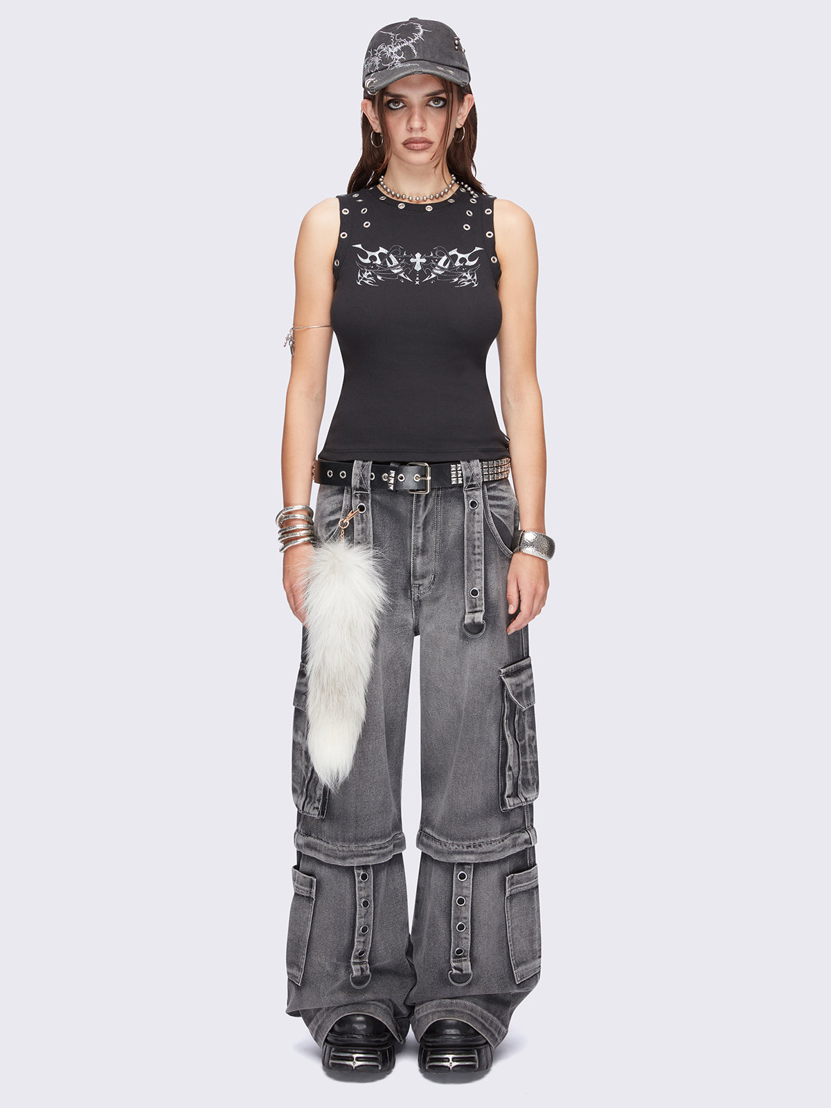 Black tank top with tribal sigilism front print and eyelet trim details.
