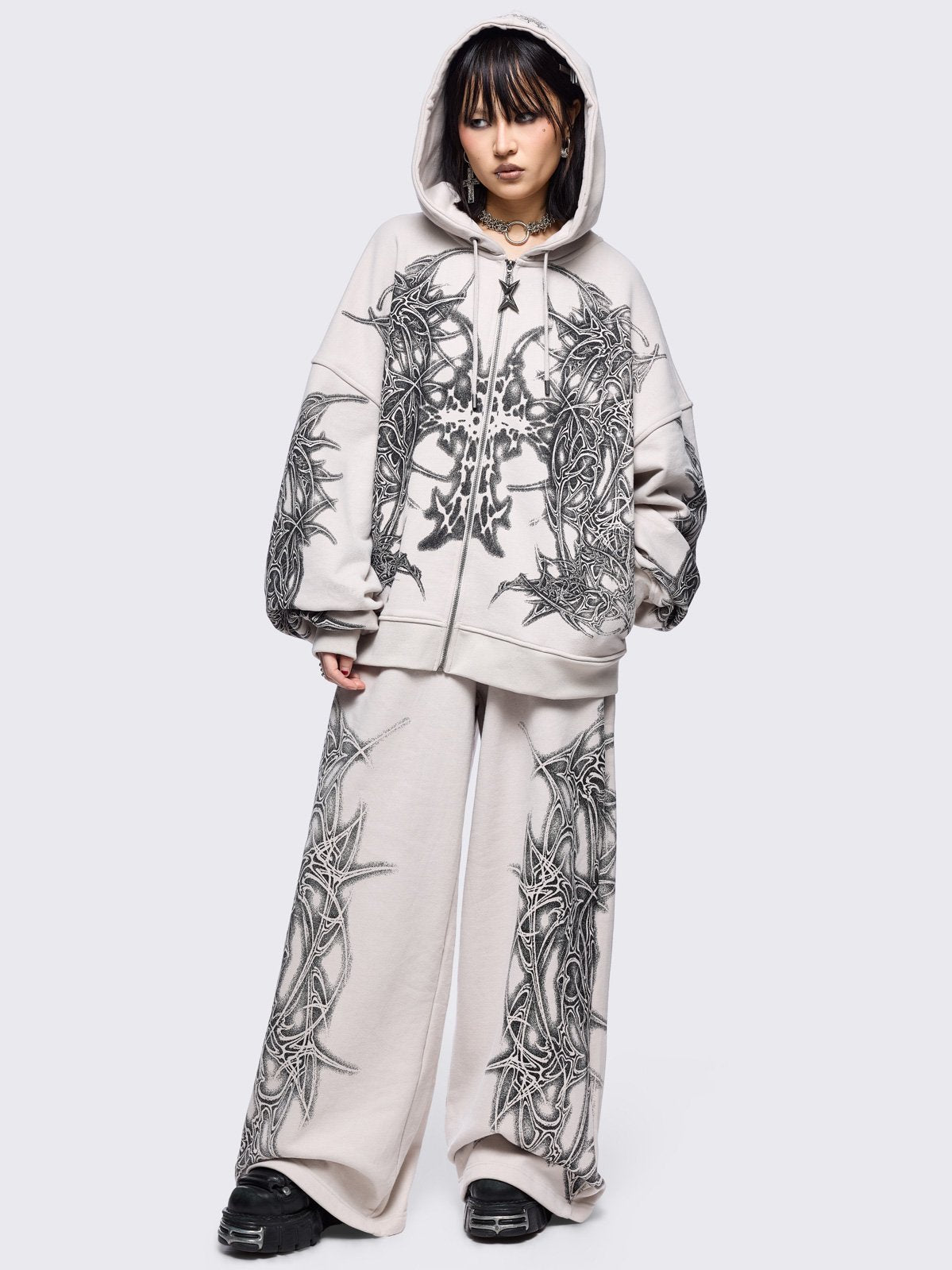 Grey zip up hoodie jacket featuring black cross sigilism graphic front and sleeves prin.t